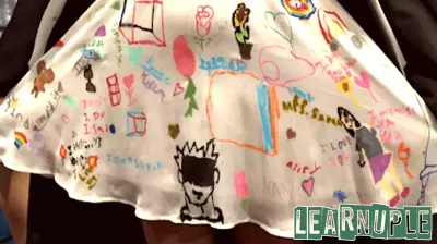 Coastal Carolina education grad wears dress decorated by her students at commencement